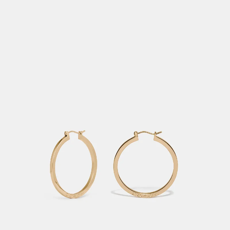 Premium Jewelry Now Available At Special Discounts COACH Hoop Earrings